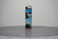 Hand-collaged lighter with sky-blue skate photography and cut-paper text reading "angry f***r." and "forever."