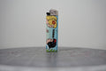 Hand-collaged lighter made from Disney comic book paper, two princesses with a cut-paper clipping reading "sapphic love"
