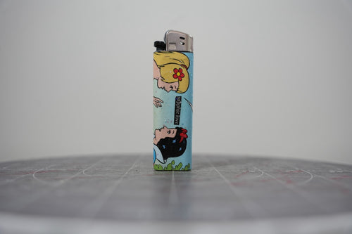 Hand-collaged lighter made from Disney comic book paper, two princesses with a cut-paper clipping reading "sapphic love"
