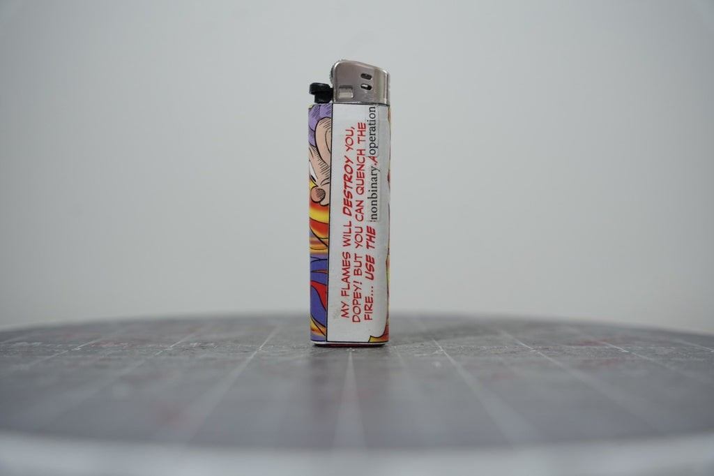 Hand-collaged lighter made from Disney comic book paper, flame panels with a speech box reading "use the nonbinary operation"