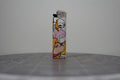 Hand-collaged lighter made from Disney comic book paper with cut-paper text reading "HUGE feminist"