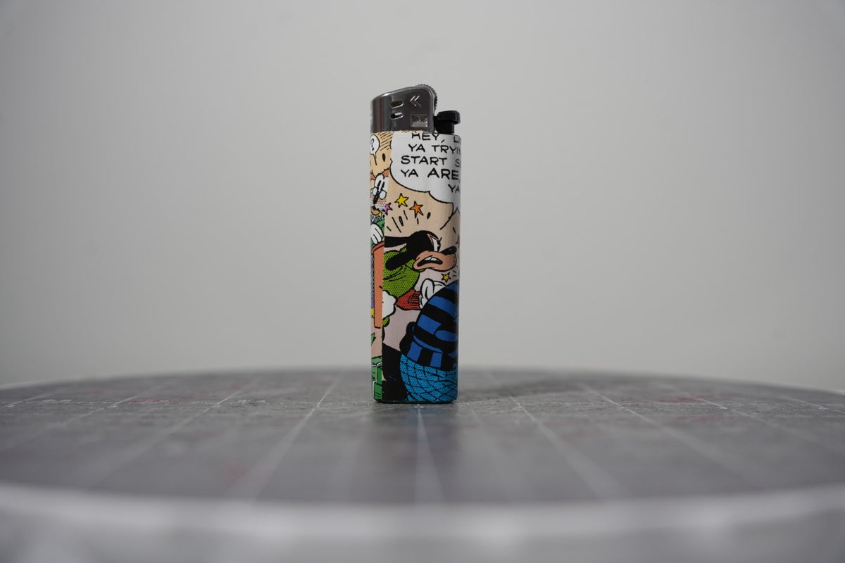 Handmade collage lighter made from vintage Disney comic book paper, Goofy in a striped shirt seeing stars
