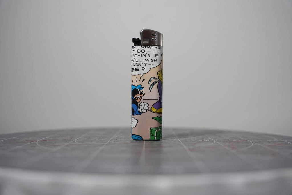 Reverse of the Disney comic book collage lighter showing a cloaked figure