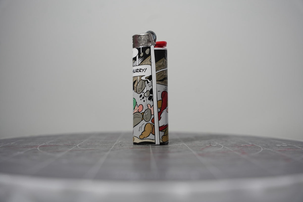 Handmade collage lighter made from vintage Disney comic book paper, dwarves running from a rockslide