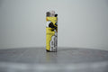 Handmade collage lighter made from vintage Disney comic book paper, Donald Duck falling on a butter yellow ground