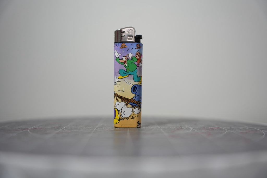 Handmade collage lighter made from vintage Disney comic book paper, crowd scene with a cannon firing
