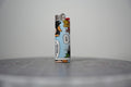 Handmade collage lighter made from vintage Disney comic book paper, the Evil Queen in her crown on sky blue