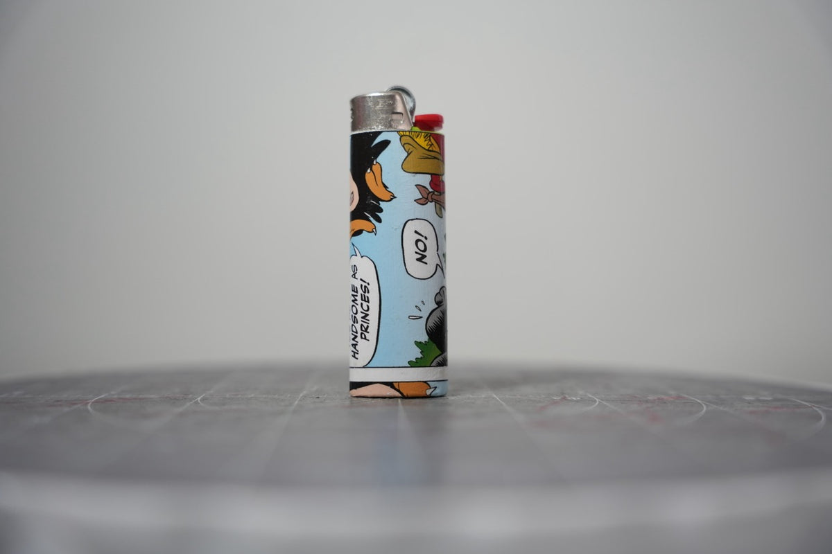 Handmade collage lighter made from vintage Disney comic book paper, the Evil Queen in her crown on sky blue