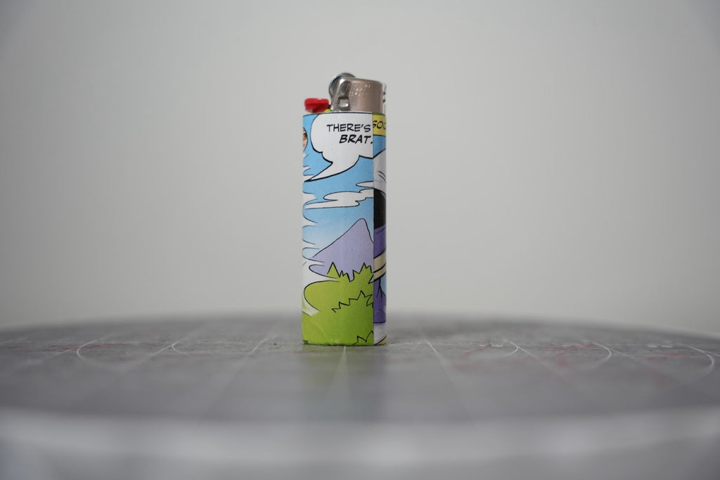 Handmade collage lighter made from vintage Disney comic book paper, the Evil Queen holding a yellow lightning bolt