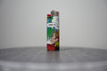 Handmade collage lighter made from vintage Disney comic book paper, a dwarf in a pine tree saying dern it