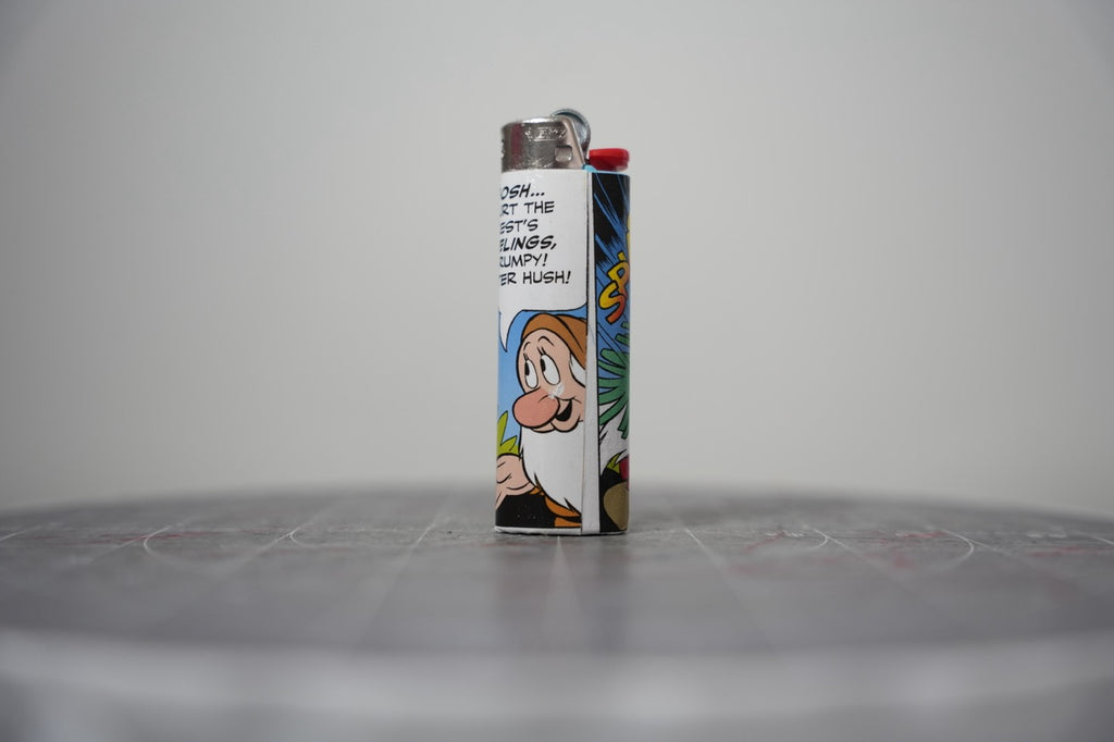 Reverse of the Disney comic book collage lighter showing more pine branches