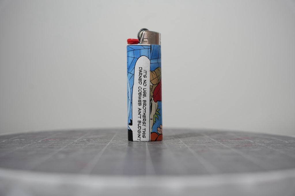 Reverse of the Disney comic book collage lighter showing the cobweb speech balloon