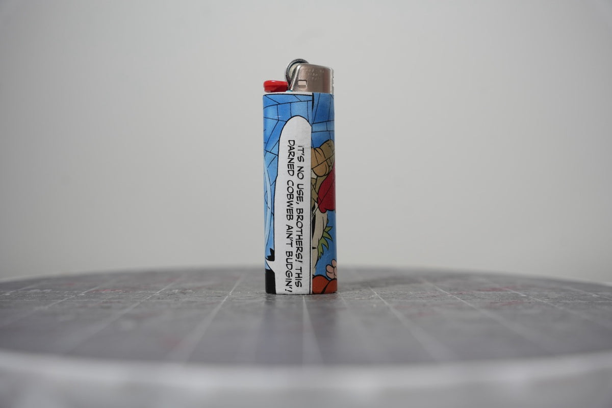 Reverse of the Disney comic book collage lighter showing the cobweb speech balloon