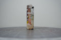 Front of a handmade collage lighter made from vintage Disney comic book paper, Mickey Mouse with cut-paper text reading trans people are badass