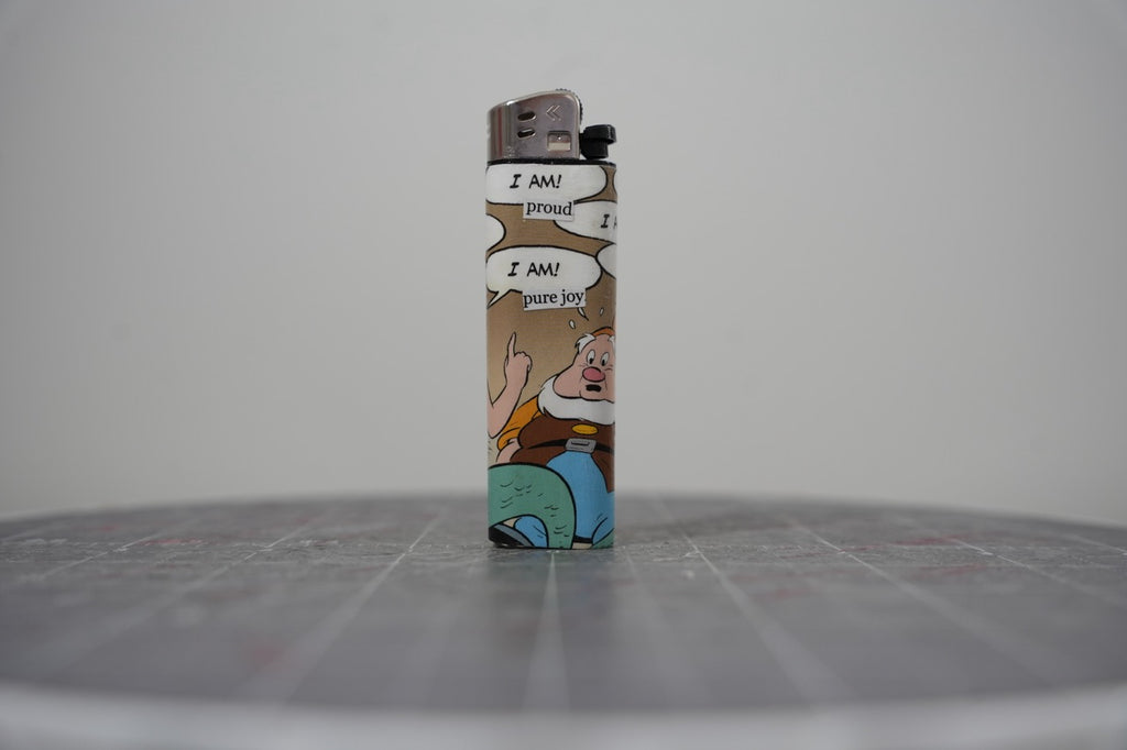 Reverse side of the same Disney comic book collage lighter