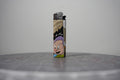 Handmade collage lighter made from vintage Disney comic book paper, Dopey in his purple cap