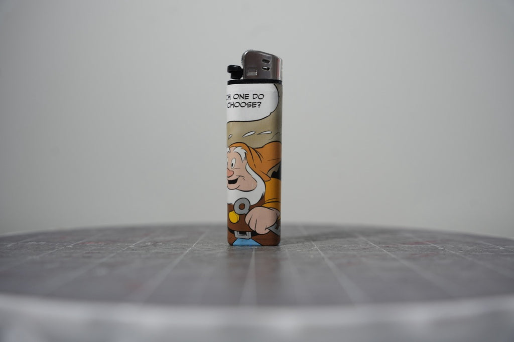 Reverse of the Disney comic book collage lighter showing a bearded dwarf and the words which one do you choose