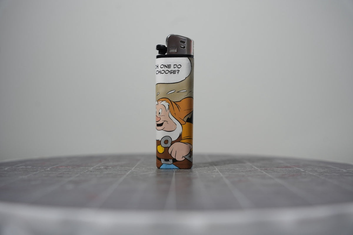 Reverse of the Disney comic book collage lighter showing a bearded dwarf and the words which one do you choose