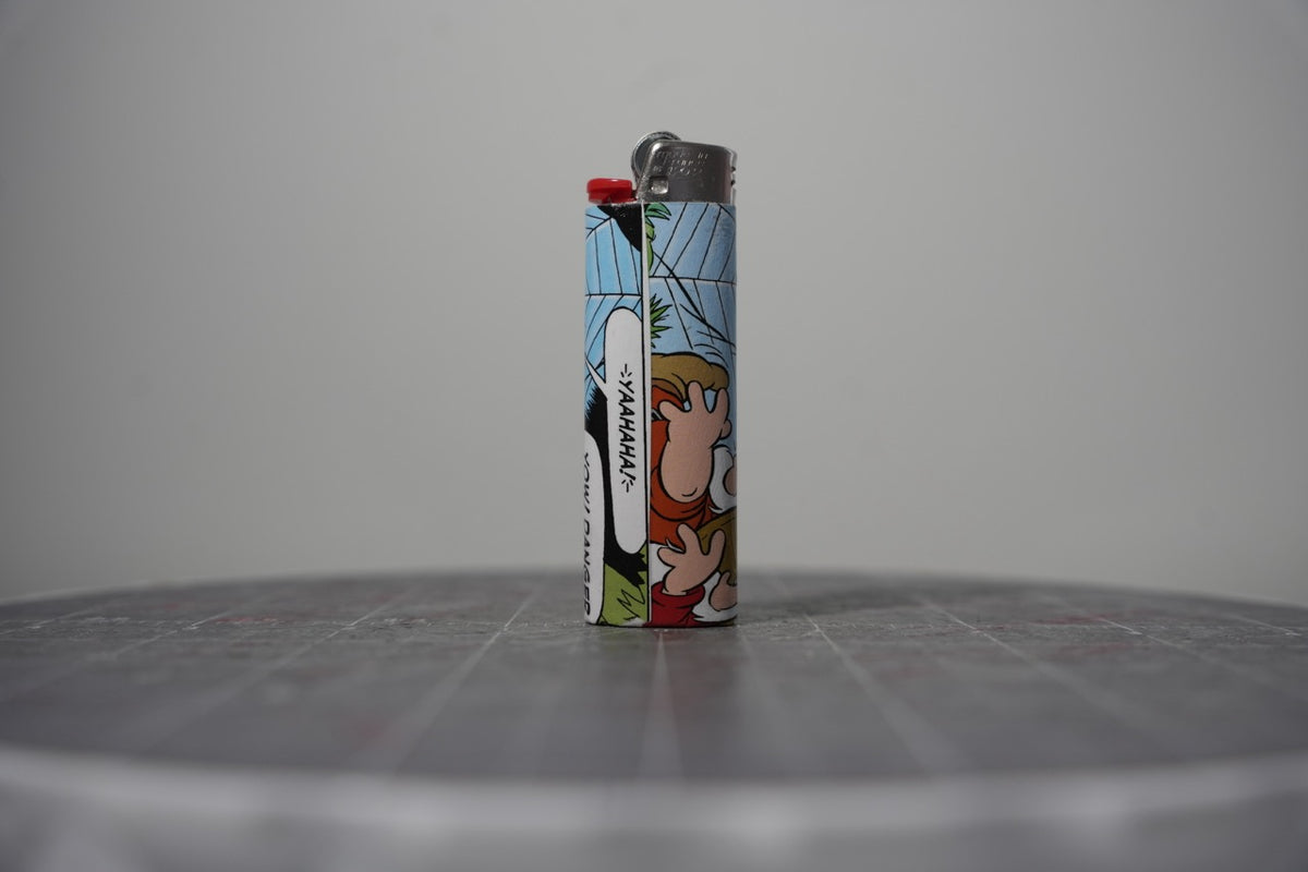 Handmade collage lighter made from vintage Disney comic book paper, hands flailing and the word yaahaha