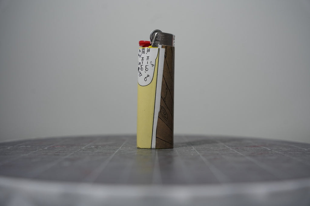 Reverse of the Disney comic book collage lighter showing a wood plank panel
