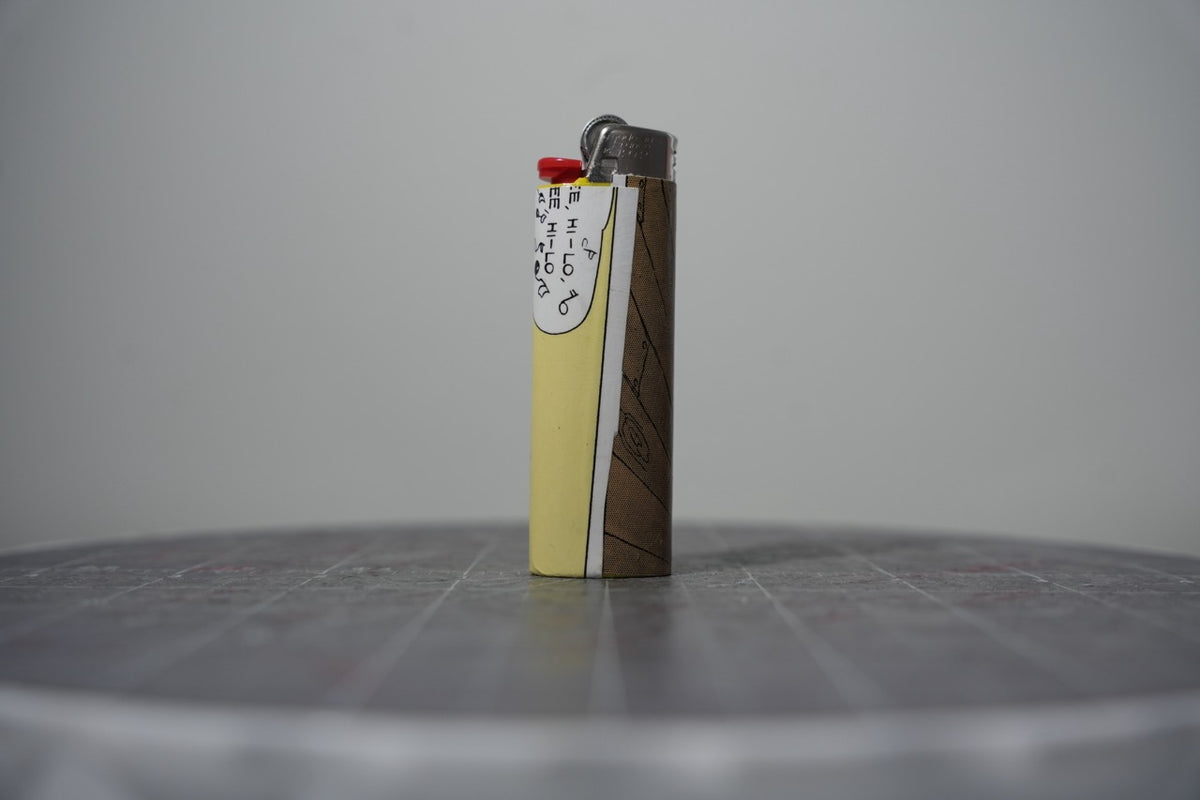 Reverse of the Disney comic book collage lighter showing a wood plank panel