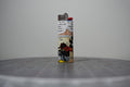 Handmade collage lighter made from vintage Disney comic book paper, Goofy sobbing next to Mickey