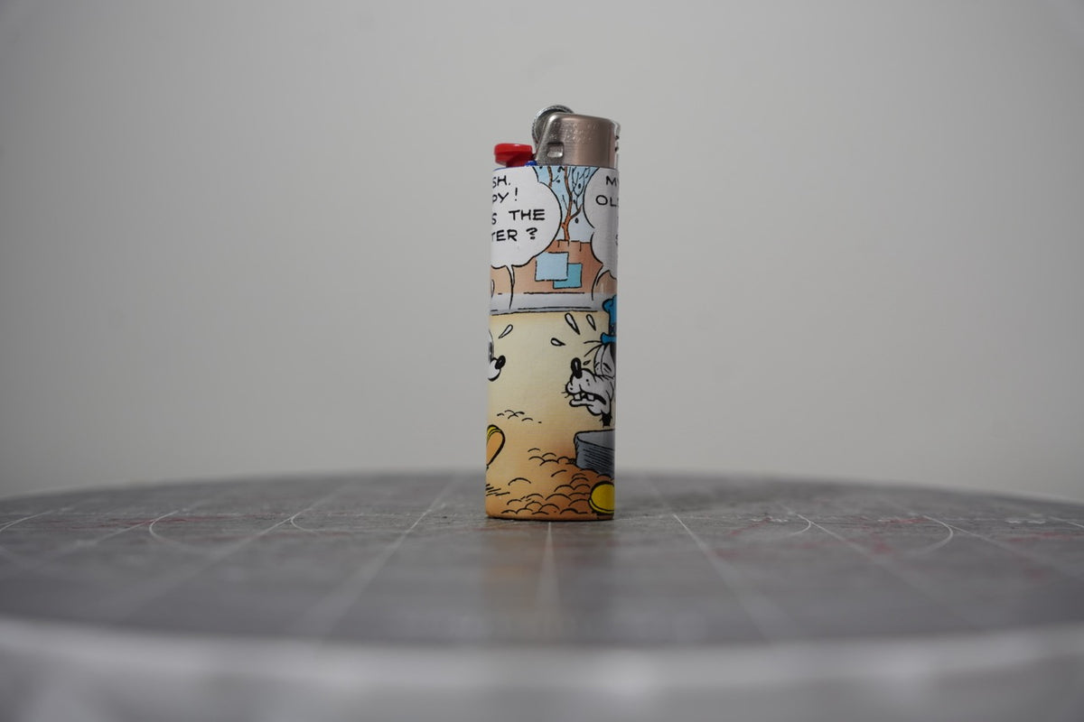 Reverse of the Disney comic book collage lighter showing Mickey asking what's the matter