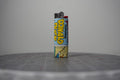 Handmade collage lighter made from vintage Disney comic book paper, featuring Donald Duck cover lettering
