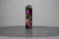 Handmade collage lighter with a cartoon bird in yellow sunglasses and the word joyous