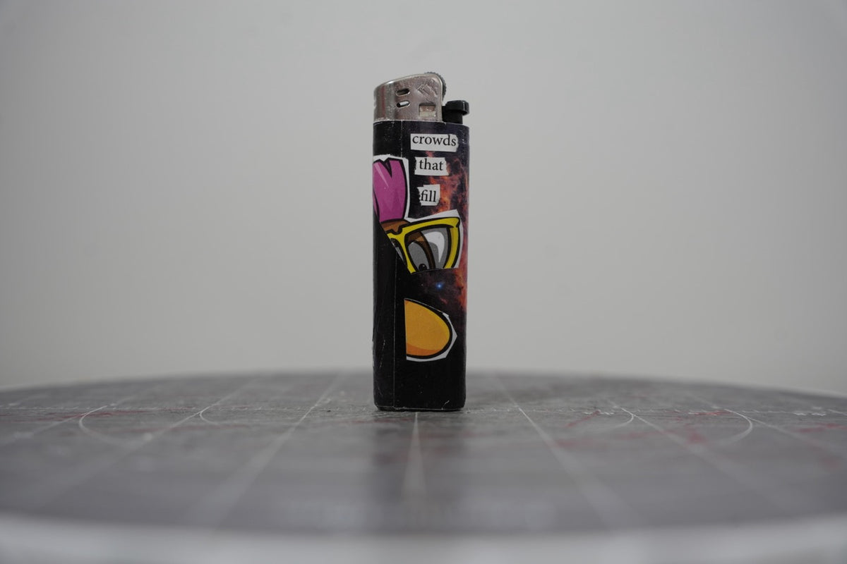 Reverse of the collage lighter showing the words crowds that fill