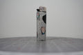 Handmade collage lighter with a fist in a rainbow wristband and the words stop patriarchy and misogyny