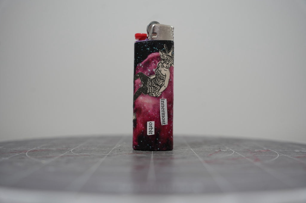 Reverse of the collage lighter, magenta galaxy with the words innermost orbit