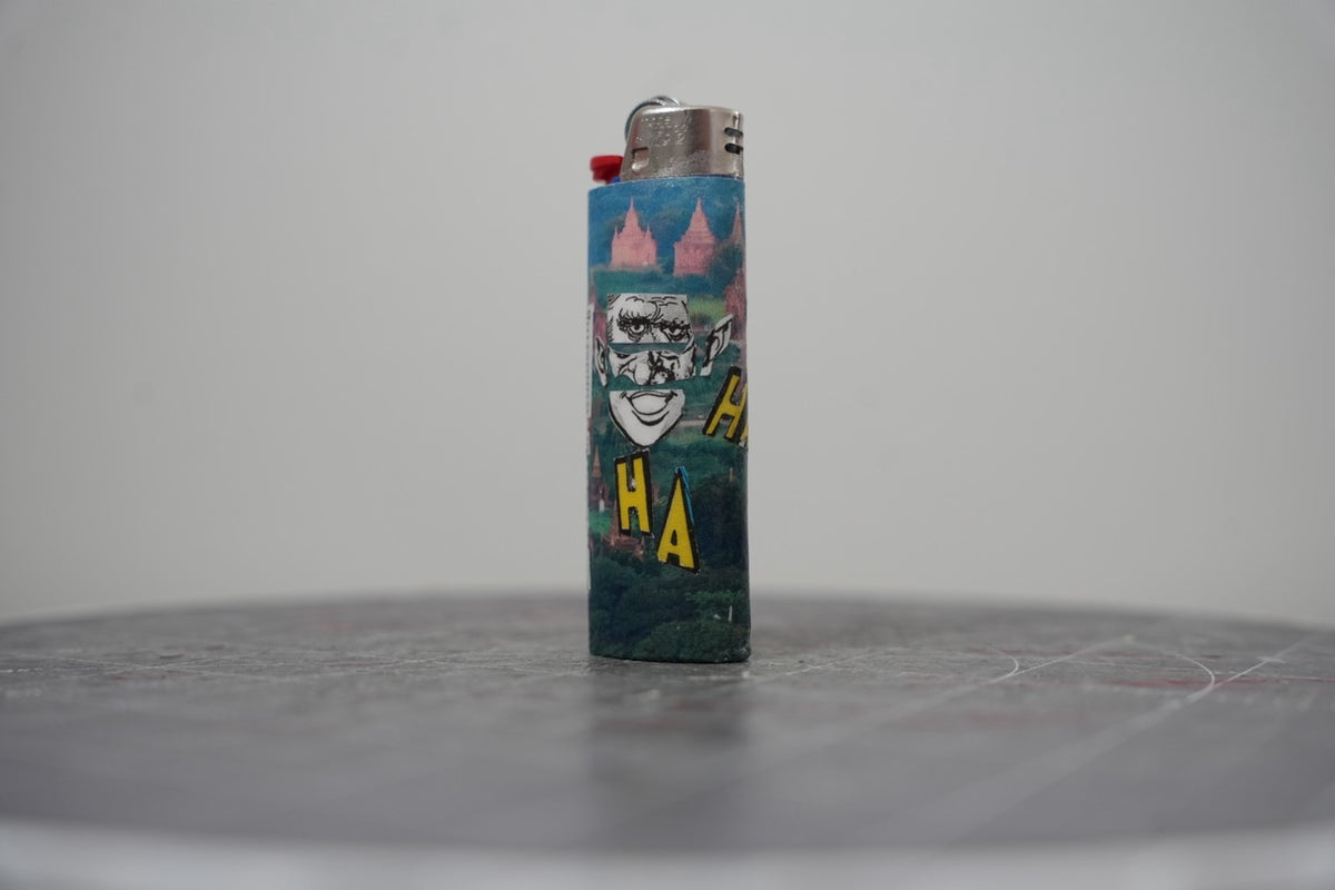 Fourth view of the collage lighter showing the yellow HA HA letters