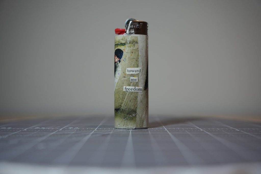 Handmade collage lighter, pale cream and sage with the words toward my freedom