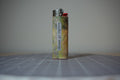 Handmade collage lighter, mottled olive and gold with the words bundles of energy
